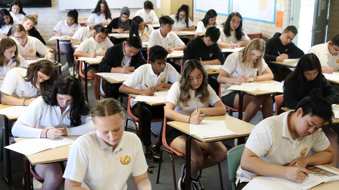 High school students studying in modern classroom